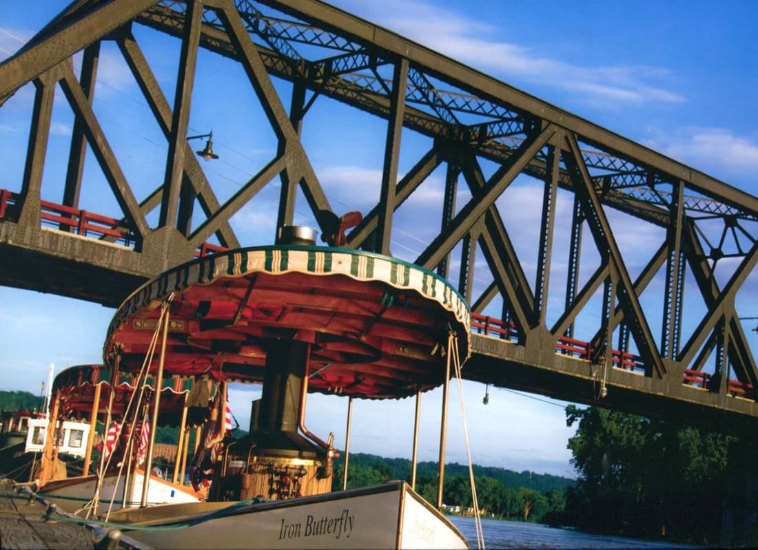 Canal boat passing below a steel bridge in Waterford